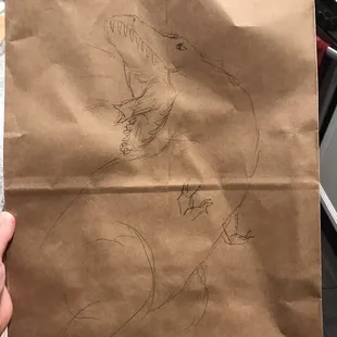 a drawing of a man on a paper bag