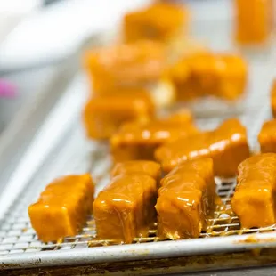 a close up of a tray of donuts