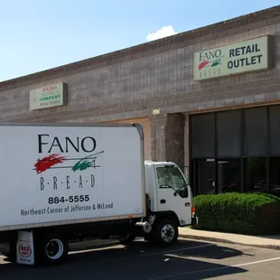 a truck parked in front of a building