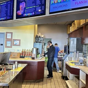 a man standing in a coffee shop