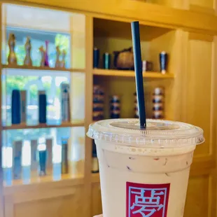 a hand holding a cup of coffee