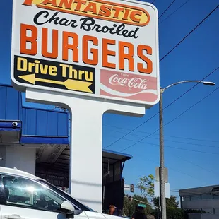 a car parked in front of a fast food restaurant