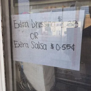a sign in the window of a fast food restaurant