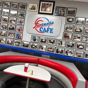 a corner booth with a table and chairs