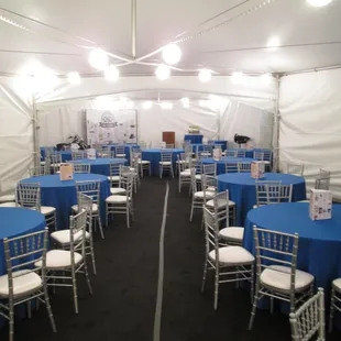 Transformed a warehouse by erecting a tent, adding carpet, chairs and colorful linens.