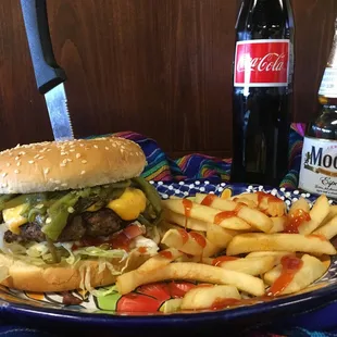a hamburger and fries on a plate