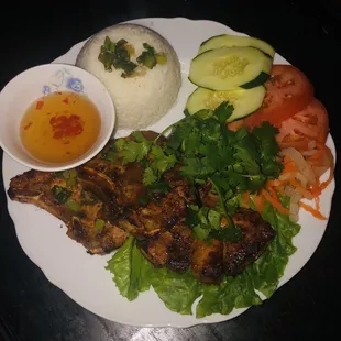 Cơm tấm sườn thịt nướng. Broken rices with grilled chopped pork.with sauce fish