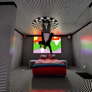 a man doing a handstand on a bed