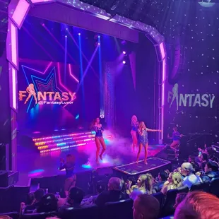 a group of dancers on stage