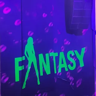 a woman in a green dress and a purple background