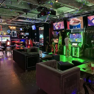 people playing video games in a bar