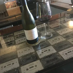 Try one of the dozens of wines we have by the glass at the cassette bar...