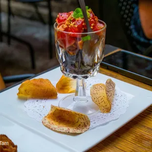 a plate of food and a glass of beer