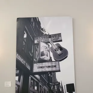 a guitar hanging on a wall