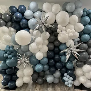 A balloon wall is a dynamic and visually striking decoration that can transform any space into a festive and enchanting environment.