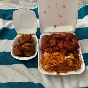 3 item plate with double orange chicken and sesame chicken.
