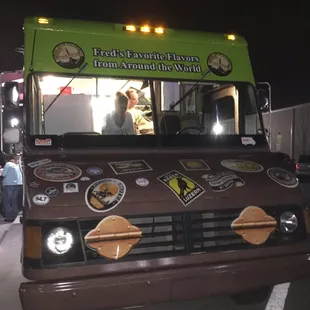 a man standing in front of a food truck