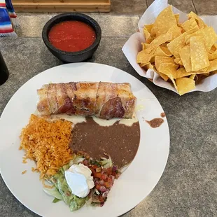 a plate of mexican food and chips