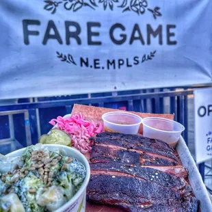 Slow-Cooked Ribs, Smoked with Dry MN Red Oak Logs. Side of Black Pepper BBQ Sauce and Mustard Jalapeño BBQ Sauce