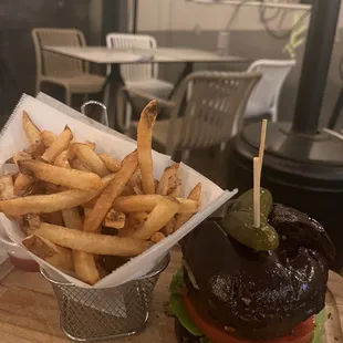 a burger and fries on a table