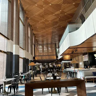 a dining area with tables and chairs