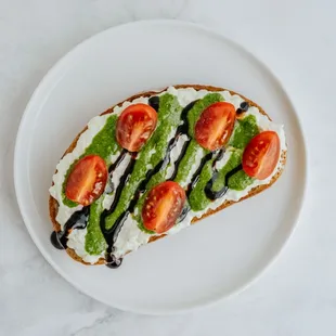 Caprese. Stracciatella Cheese, Pesto, Balsamic Glaze, Campari Tomatoes.