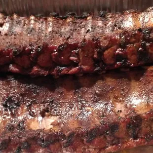 Fargo's Succulent Baby Back ,Ribs smoke for 8 hours or more. It comes with Sauce on  the Ribs,  or Sauce on the side.
