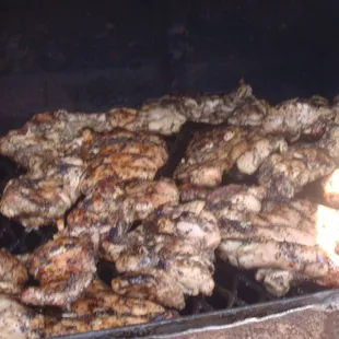 Boneless Jerk Chicken on the grill.