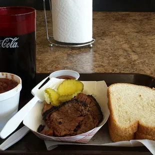 A few slices of delightfully tender brisket &amp; a couple slices of bread to slap them between.