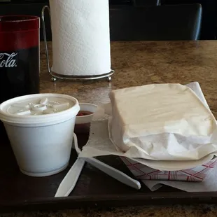 Wonder Bread under wraps &amp; BBQ beans in the lidded container.