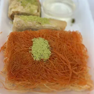 a variety of food items in a styrofoam container