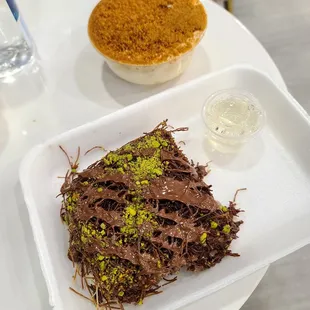 chocolate kunafa, (pass, it tastes like burnt chocolate). Biscoff pie behind (more like tres leches with Biscoff)