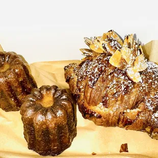 Here are a couple of Canelé's, next to an Almond Croissant.