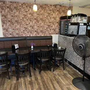 a dining area with a fan