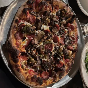 Pepperoni, mushroom, and green chili pizza