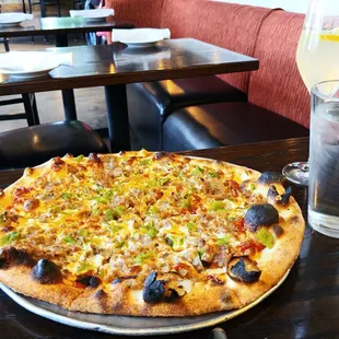 Sausage/green chile pizza, 1 drink = $39 (before $10 tip). It was good, but that&apos;s nuts.