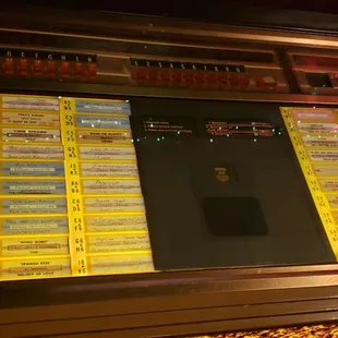 a juke box with tickets on it