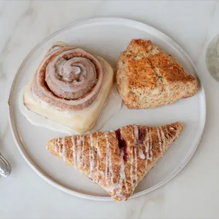 Cinnamon roll, herb scone, &amp; raspberry turnover