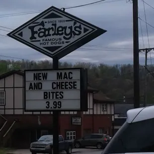 a sign for a new mac and cheese bites
