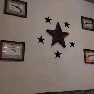 Wall featuring old west guns.