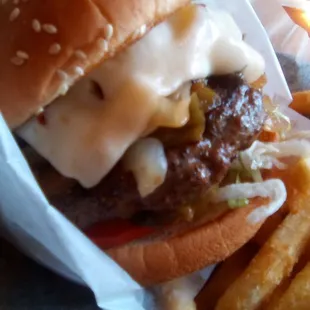Farley's huge Mesilla Mex Burger. Grilled onions were greasy and bun deteriorated. Must use a knife and fork. Under seasoned meat.