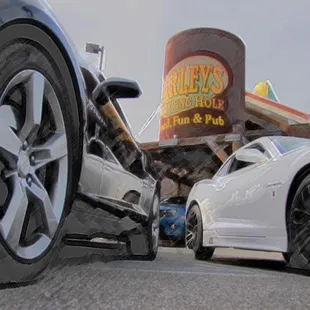two cars parked in front of a restaurant