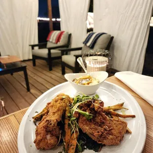 a plate of food on a wooden table