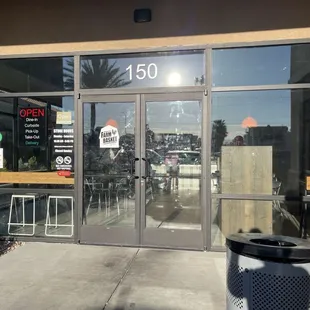 Front Door with Hours of Operation (Monday-Saturday 10:30 AM-9:00 PM)