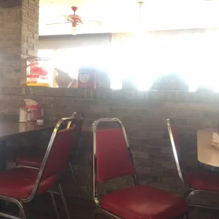 red chairs and a brick wall