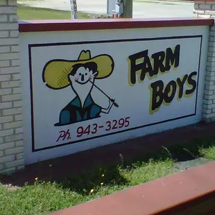 a sign for a farm boy's business