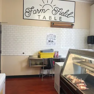 a butcher's counter with meat in it