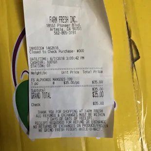 a receipt on a yellow package