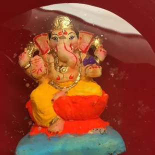 a small statue of a gan