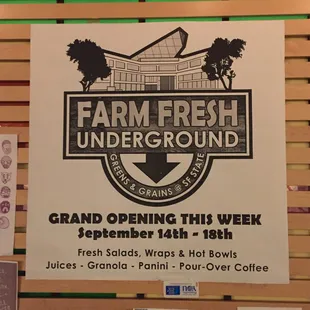 a sign for the grand opening